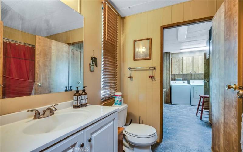 Second bathroom opens to second bathroom and large laundry room