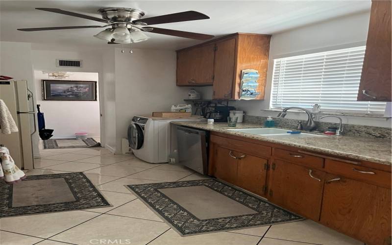 New sink, faucet, countertops, oven, vent hood.