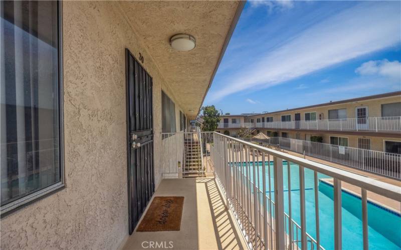 Photo of front door overlooking community pool & spa!