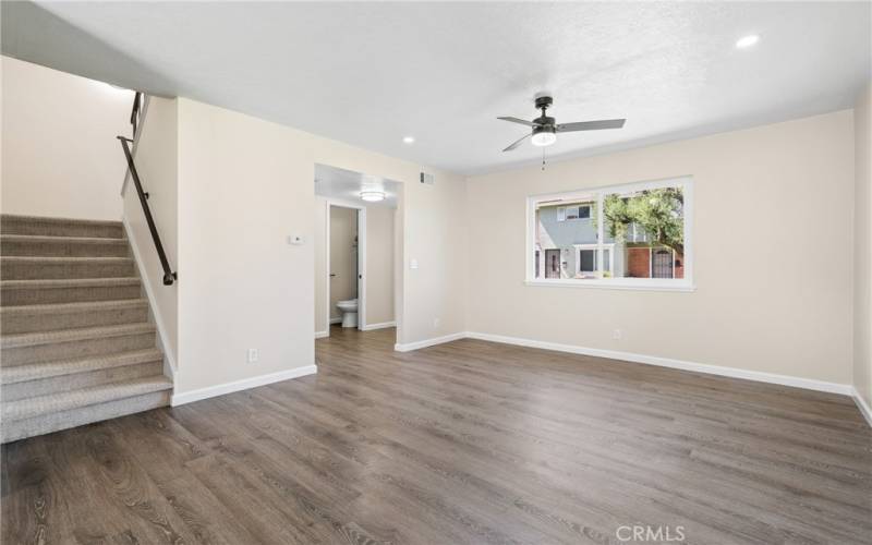 Entering the home, you are greeted by a bright and spacious family room with laminate floors and a new dual paned window!