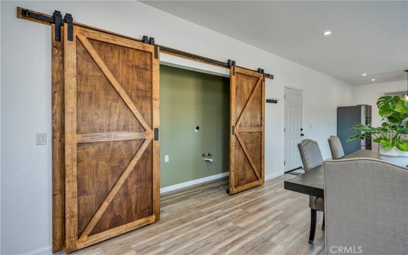 Custom barn doors, plumbing behind , can add sink, shelving anything