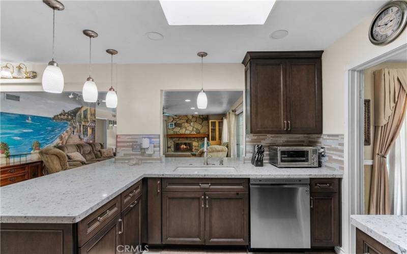 Remodeled kitchen with quartz counter tops and fine cabinetry.