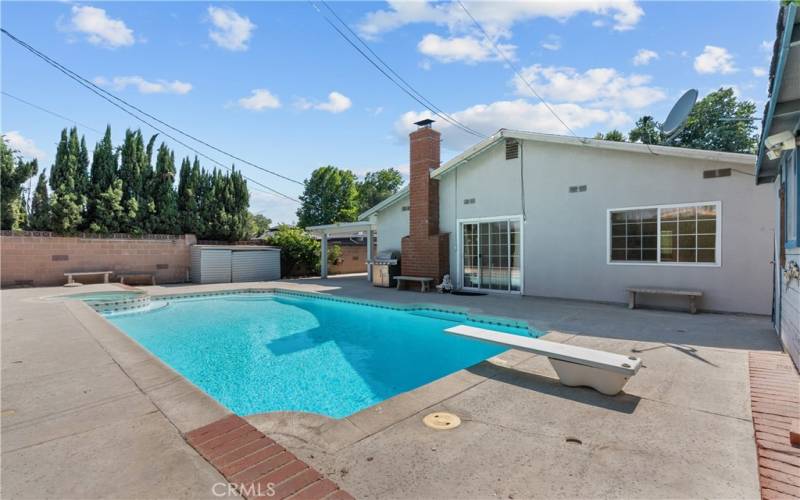 Private backyard with covered patio, sparkling pool and spa.