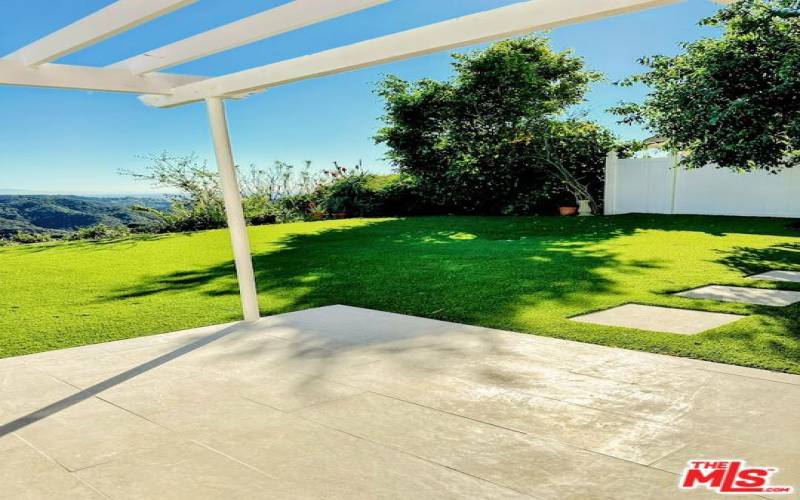 Lush Backyard Turf With Stone Accents