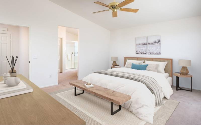 Primary Bedroom has ensuite bath with separate soaking tub and shower.  Virtually staged photo.