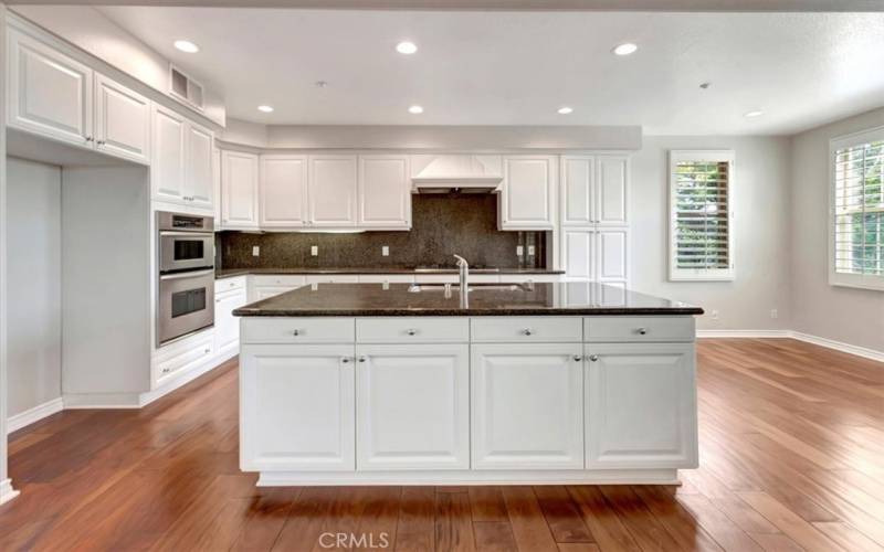 Kitchen with gas cooktop, built-in oven & microwave.