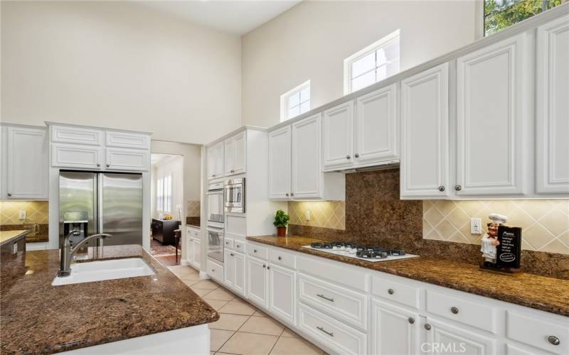 The Kitchen is clean and bright with high ceiling, island and open to the family room.The kitchen is bright and clean with a high ceiling, island, and open to the family room.