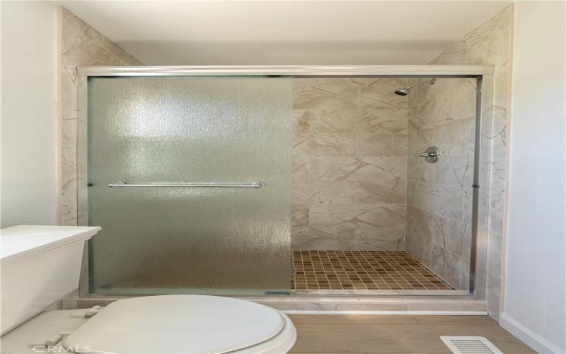 Spacious shower in primary suite