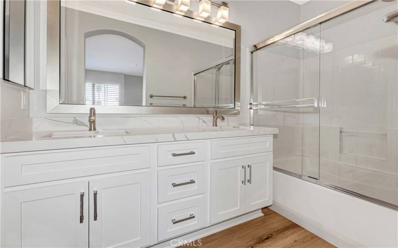 Remodeled Primary bath with double sinks & tub/shower.