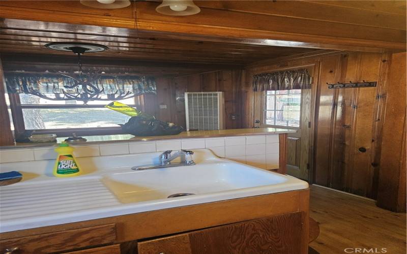 Sink and view of outside to backyard from kitchen on main level