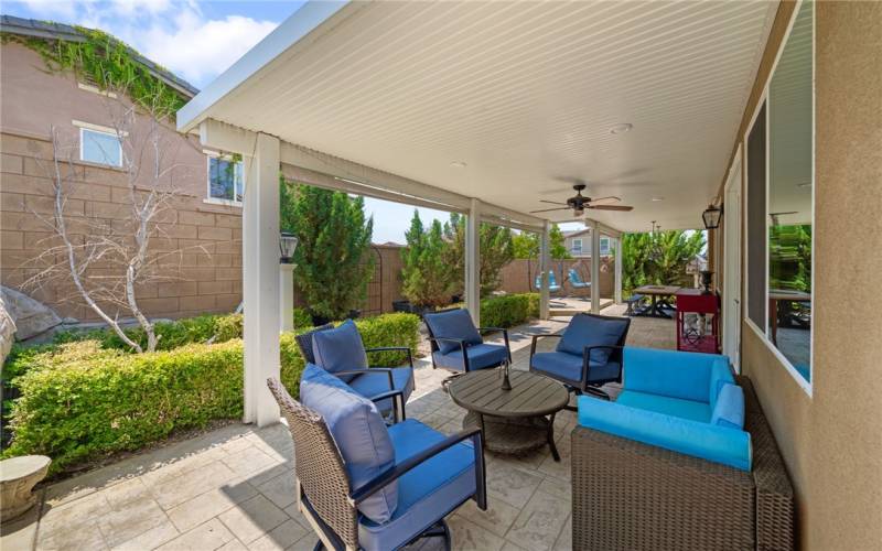 Great outdoor space with alumawood patio cover and stamped concrete patio