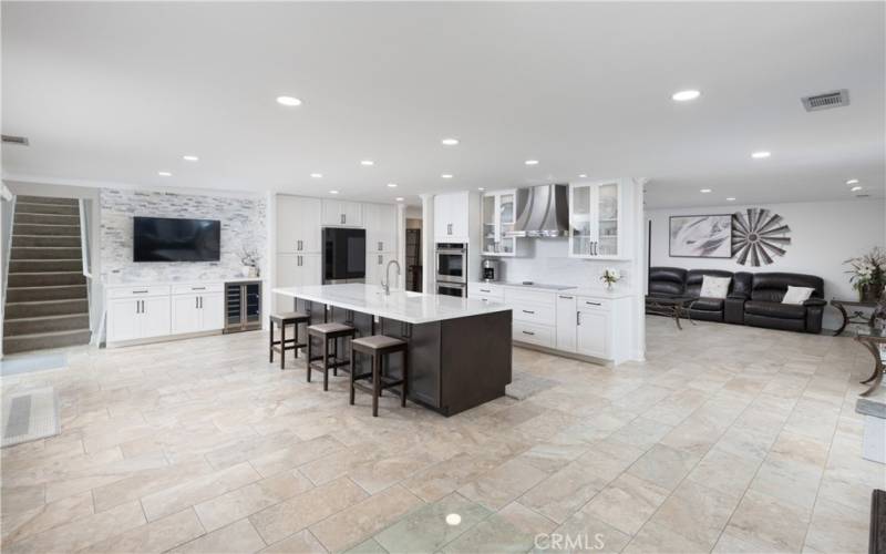 Large great room for family and gatherings!! Real marble counter tops and 10 ft. island, makes this room exceptional. Wine & Coffee bar with new Wine fridge, and new appliances.