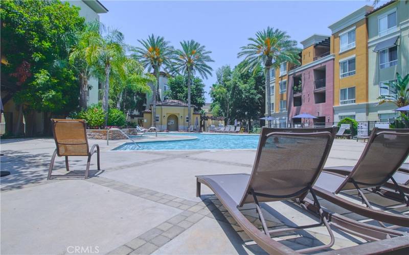 Pool Area w/multiple lounging chairs