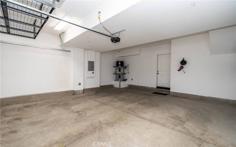 Attached 2 car garage with lots of storage and a 220v EV receptacle.