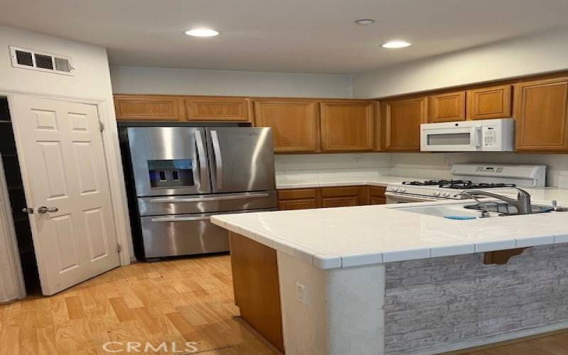 Kitchen partial (Large Pantry, Newer Refrigerator and Microwave) Recessed lighting, Gas Range