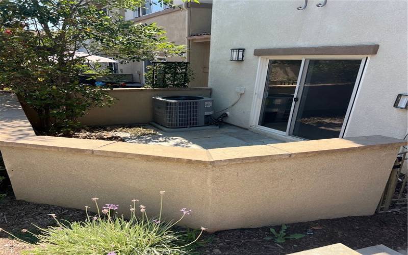 The Patio is graced with a lovely mature magnolia tree and convenient direct entry off of the living room.