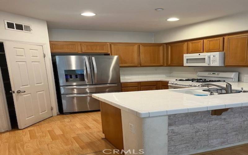 Kitchen partial (Large Pantry, Newer Refrigerator and Microwave) Recessed lighting, Gas Range