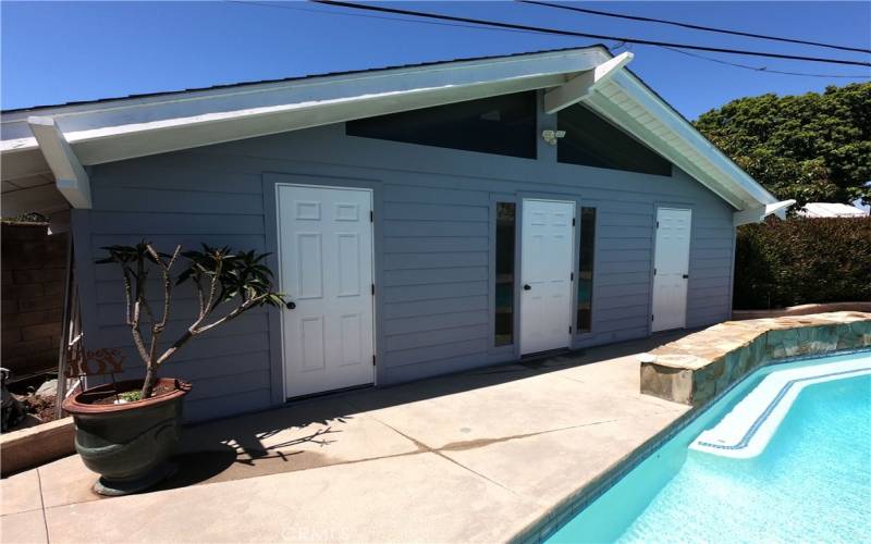 Pool house with two storage units and pool EQ inside center door