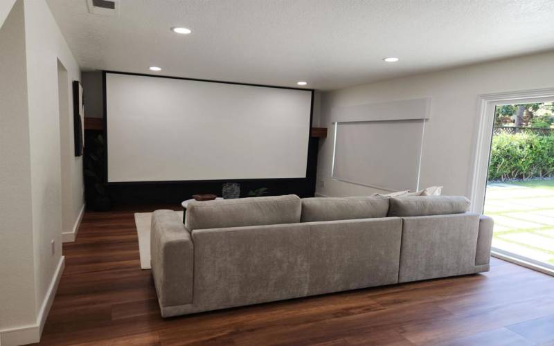 Family Room with Screen exposed for Game Day or Movie Night!