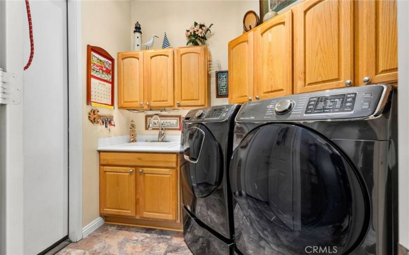 Laundry room with deep utility sink and lots of storage