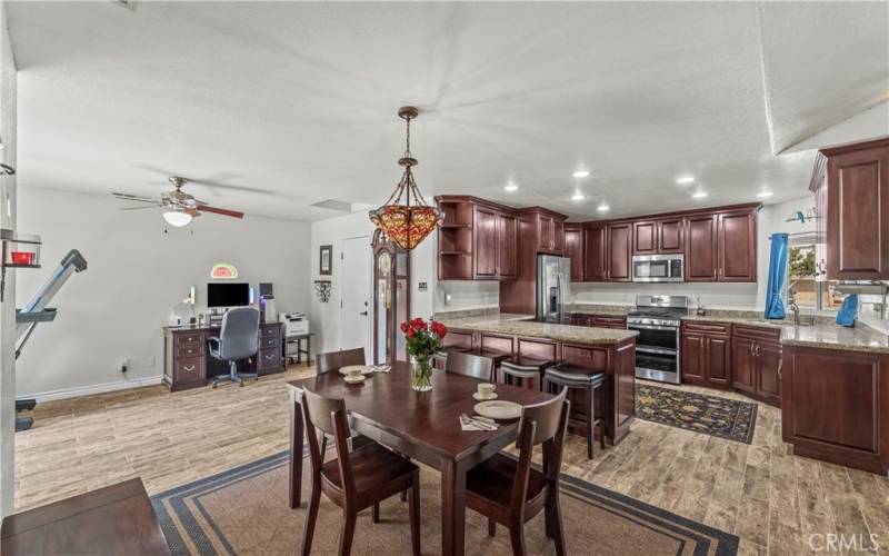 Dining room into the remodeled kitchen with cherry wood cabinets, etc.