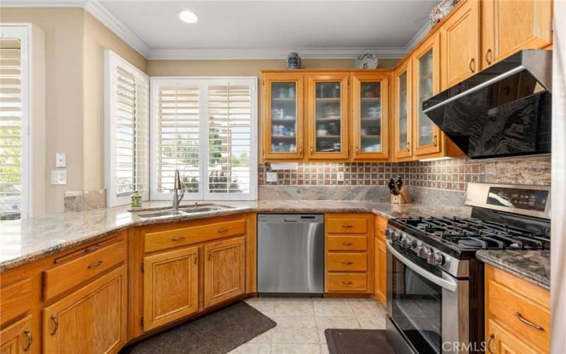 Stainless Steel Appliances / Wood Shutters / Tile Flooring