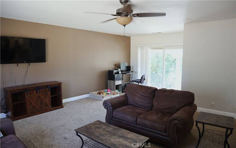 Family room, with 1/2 bath and sliding glass door to deck,