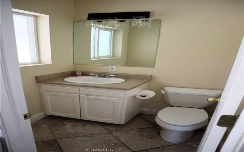 Half bathroom attached to family room, easy access for pool