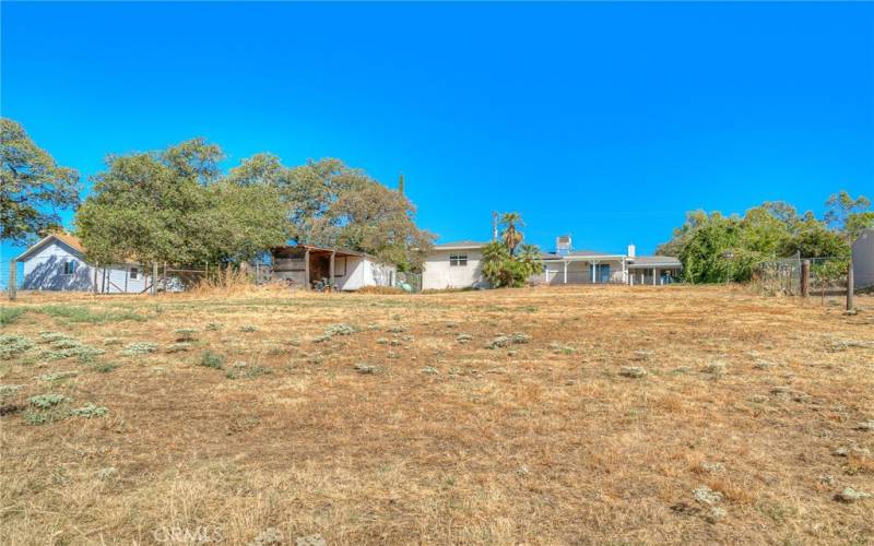 Dining room, leading to the family room and 1/2 bath, and backyard access