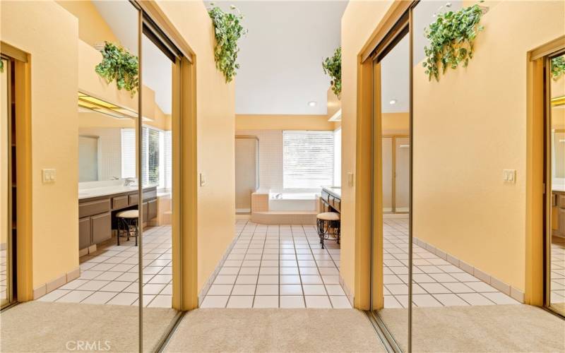 Headed into Master Bath with His and Hers walk-in Closets with Mirrored Doors.