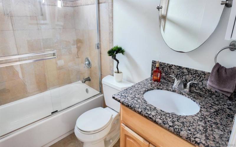 Freshly refinished tub, new shower doors and shower head.