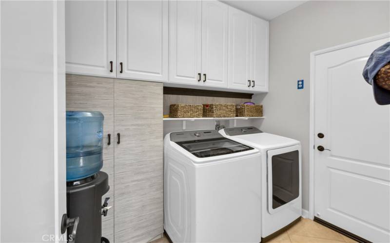 Inside Laundry Room with lots of storage.