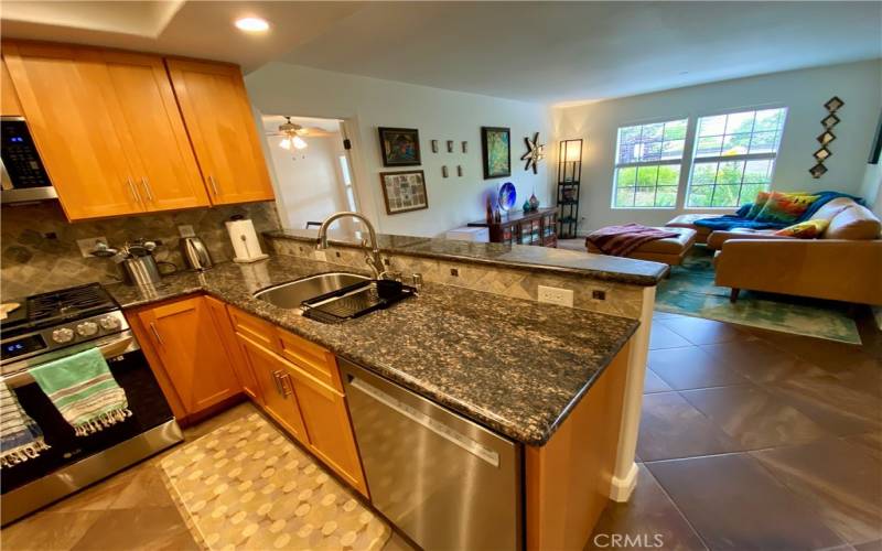Modern kitchen with granite countertops and upgraded appliances.