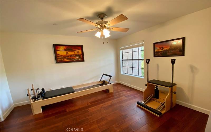 The second bedroom with a walk-in closet is currently being used with workout equipment.