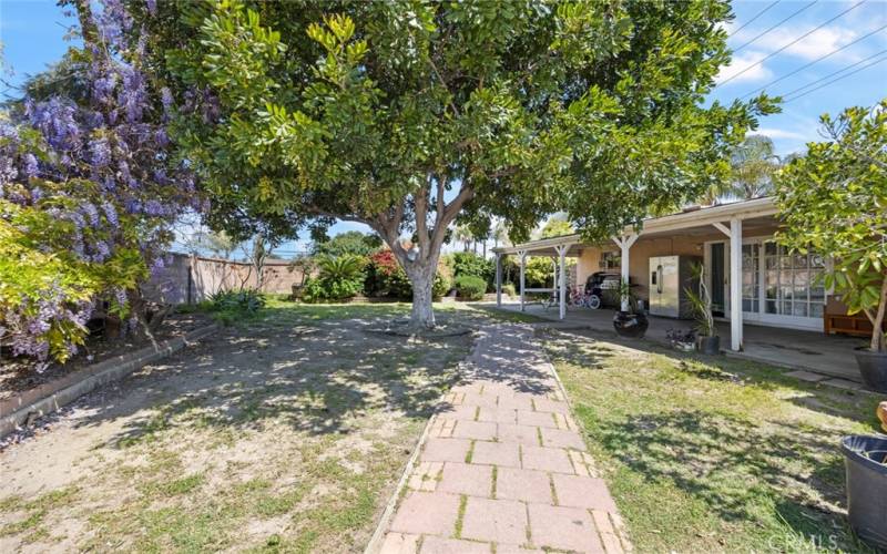 Backyard with covered patio. Perfect for entertaining.