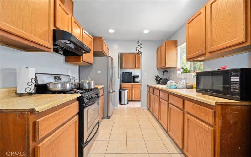 Galley kitchen with plenty of storage space.