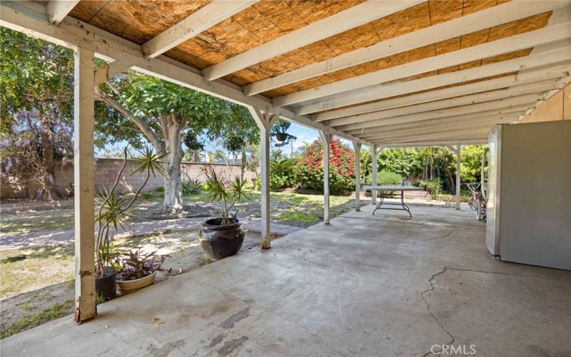 Covered patio in backyard. Perfect for entertaining.