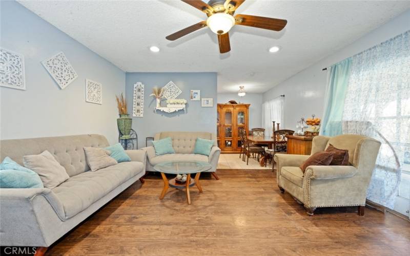 Spacious living room leading into dining area.