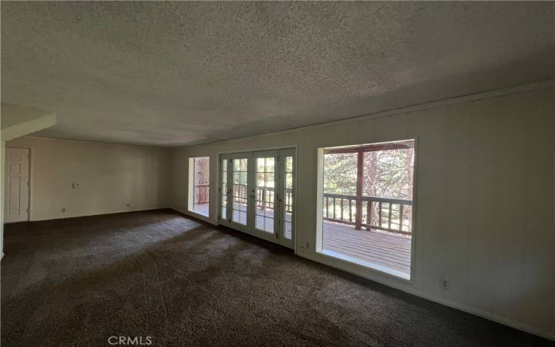 French doors lead to back deck.