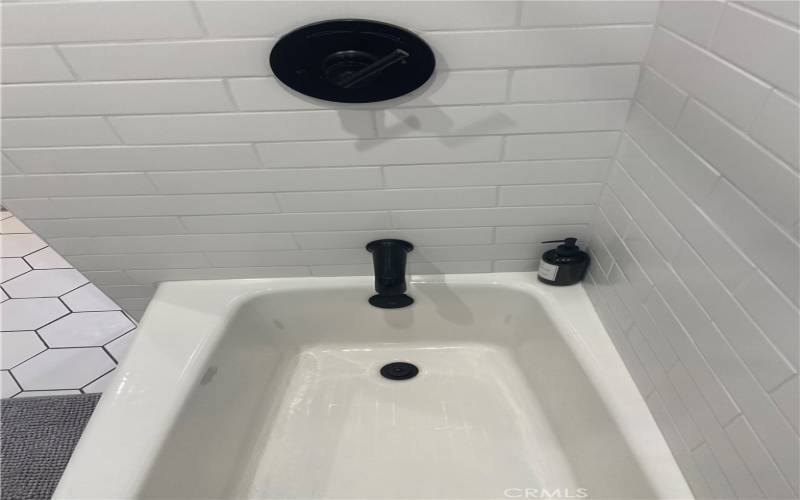 Complete remodel on the bath and shower with high wall of gorgeous white tile.....