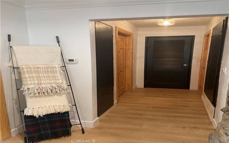 Hall way leading to second bedroom and newly remodeled bathroom, two storage areas with convenient self lighting operation....


