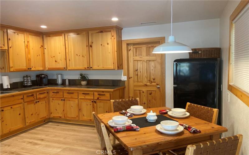 Great open kitchen with lots of counter space a cabinets, door leads to laundry room.....