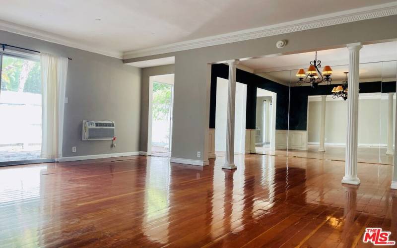 Living room facing private patio, foyer & dining room