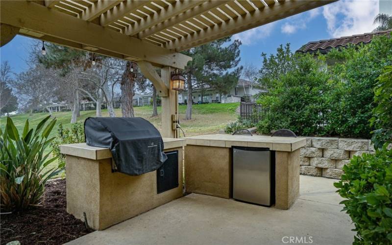 Build in BBQ with refrigerator and barstool seating