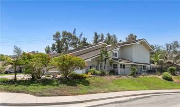 596 S. Anaheim Hills Rd is a quiet sanctuary perched on a corner lot!