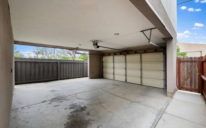 Two secure carport parking spots in rear for one bedroom and studio rentals.