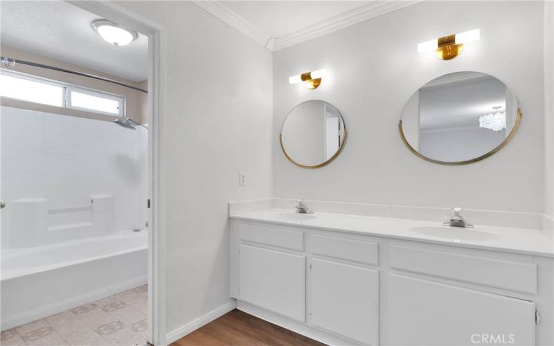 Remodeled primary bathroom vanity area. New flooring and paint.