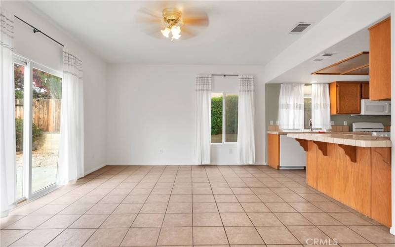 Large dining room with tile floor.