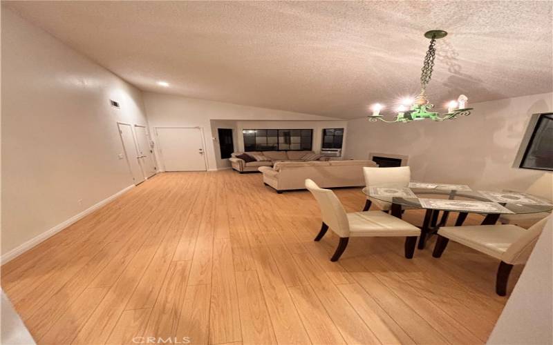 Living room with fireplace and opened to the formal dining room