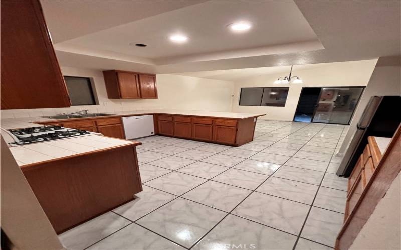 Kitchen opens to the Family Room with a sliding door to the backyard